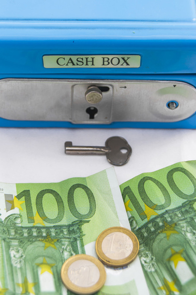 Stacks of euro coins and banknotes in a cash box - Photo, Image