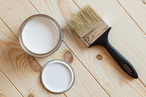 Cans of paint and brush on wooden background - Foto, Bild