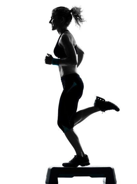 Woman exercising step aerobics - Foto, Imagem