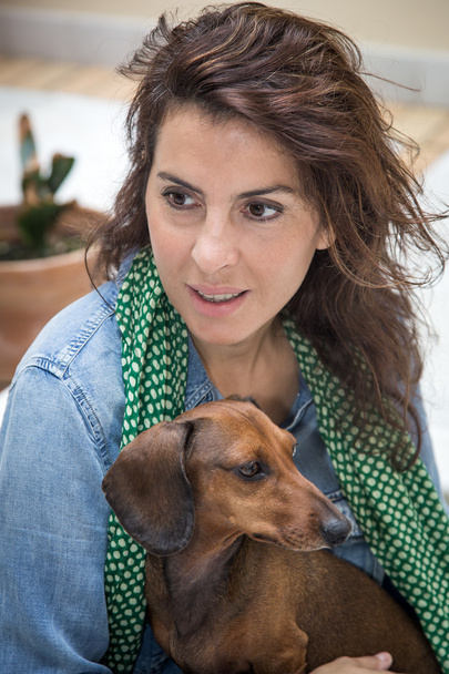 Attractive woman playing with dog - Photo, Image