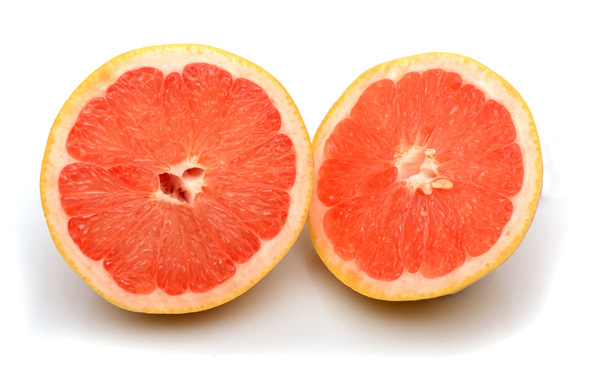 Grapefruity poloviční řez izolovaných na bílém pozadí - Fotografie, Obrázek