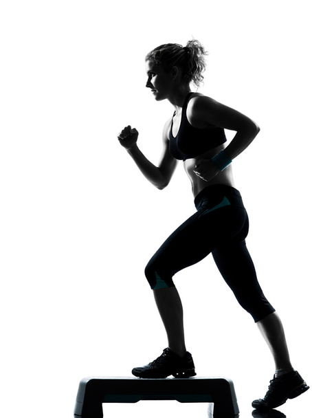 Woman exercising step aerobics - Zdjęcie, obraz