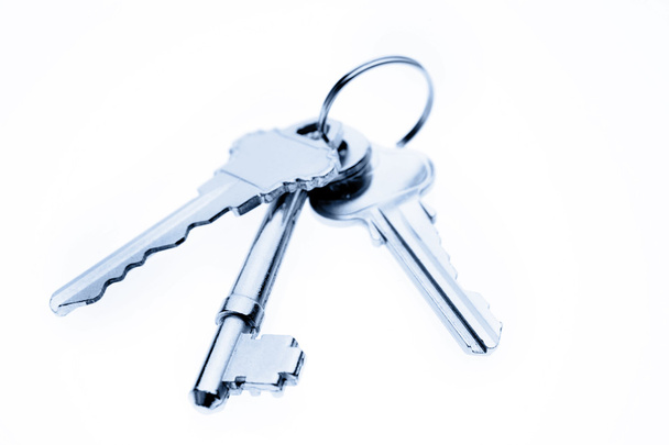 Three keys on plain background - Фото, изображение