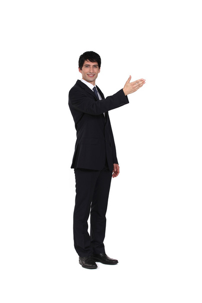A businessman showing directions. - Photo, image