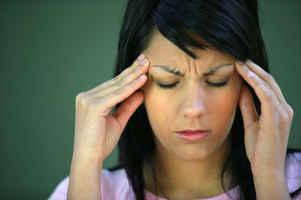 Brunette suffering from tension headache - Foto, Imagen