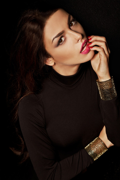 Portrait of beautiful brunette woman in black. Fashion photo - Valokuva, kuva