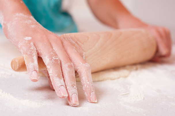 Woman hands mixing dough on the table - 写真・画像
