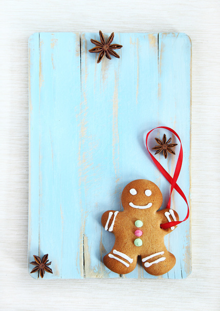Image of Gingerbread man on blue vintage cutting board - Photo, Image