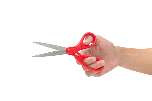 Hand is holding scissors isolated on a white background - Φωτογραφία, εικόνα