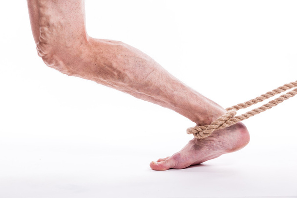 rope holding human leg ailing varicose veins of the lower extrem - Φωτογραφία, εικόνα