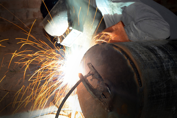 Men welding an industrial pipe closeup - Photo, Image