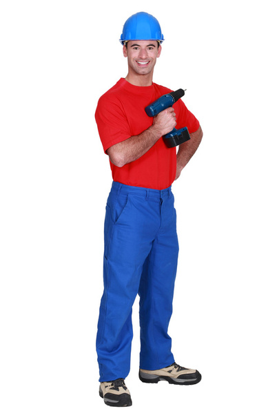 Fullbody portrait of craftsman holding cordless drill - Foto, Imagem