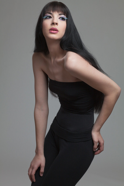 Fashion model with long dark hair. - Foto, imagen