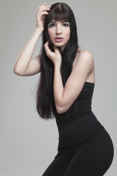 Fashion model with long dark hair. - Zdjęcie, obraz