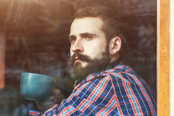 bearded man with cup of coffee - Foto, Bild
