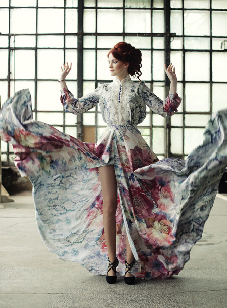 elegance woman with flying dress in palace room - Fotó, kép