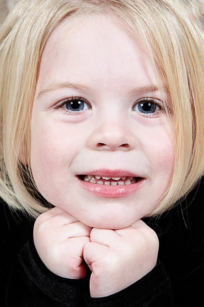 Cute little girl in studio posing for the camera - Photo, Image