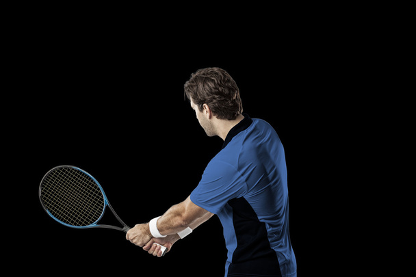 Tennis player with a blue shirt. - Foto, imagen