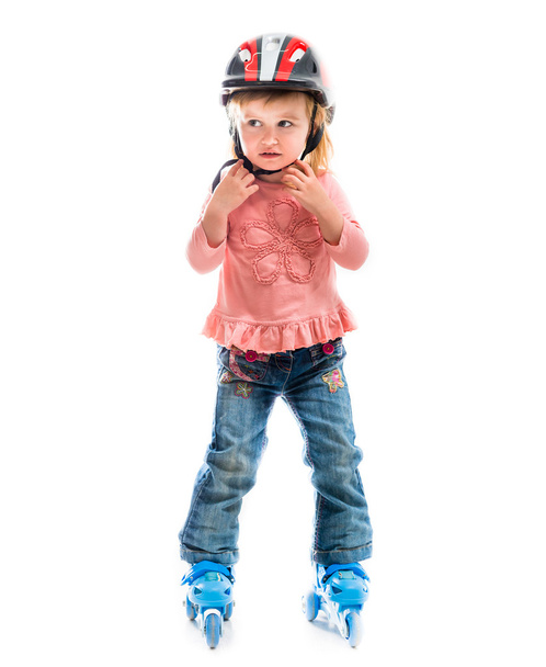little preschool girl on rollerskates - Фото, изображение