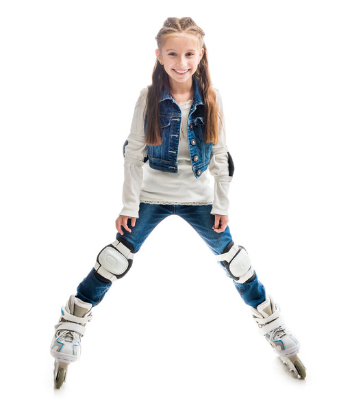 smiling teenager girl on rollerskates - Foto, Imagen