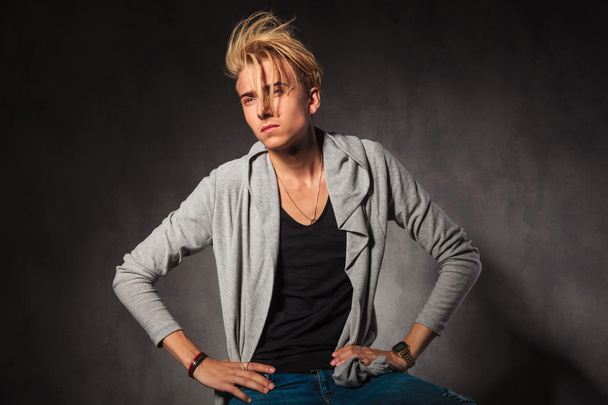 serious blond man posing in studio background while looking away - Fotografie, Obrázek