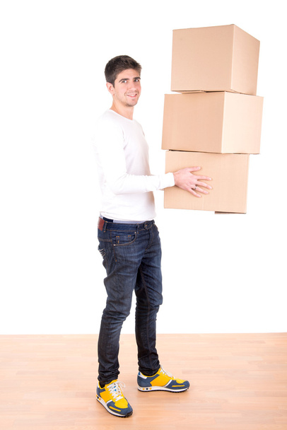 Young man with cardboard boxes - Φωτογραφία, εικόνα