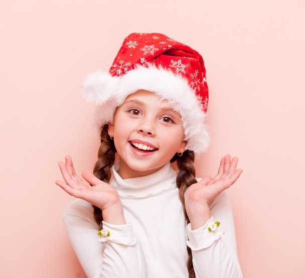 girl with pigtails in Santa Claus hat - Φωτογραφία, εικόνα
