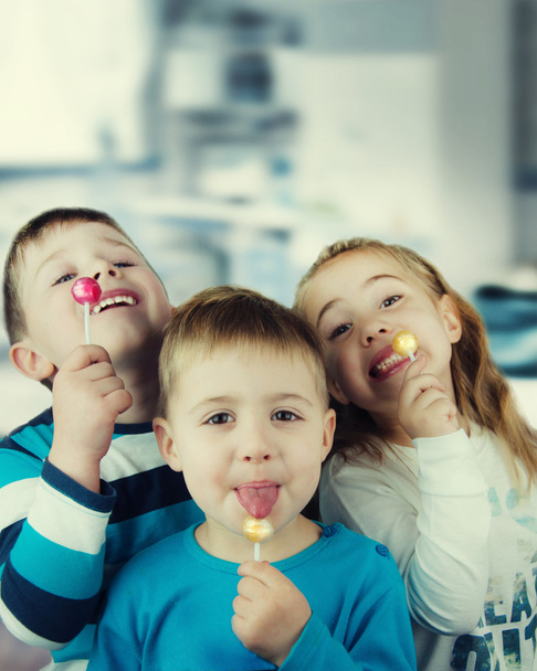 Happy kids with lollipop - Photo, Image