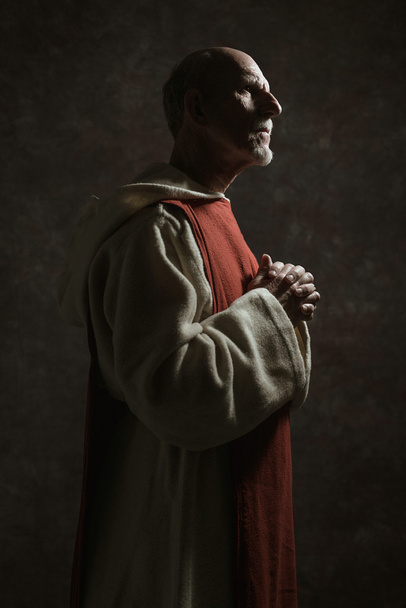 Side view portrait of wishing monastic. - Photo, Image