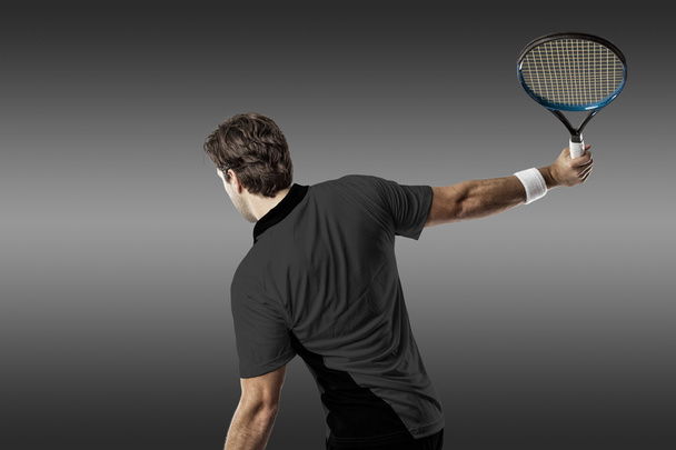 Tennis player with a black shirt. - Zdjęcie, obraz