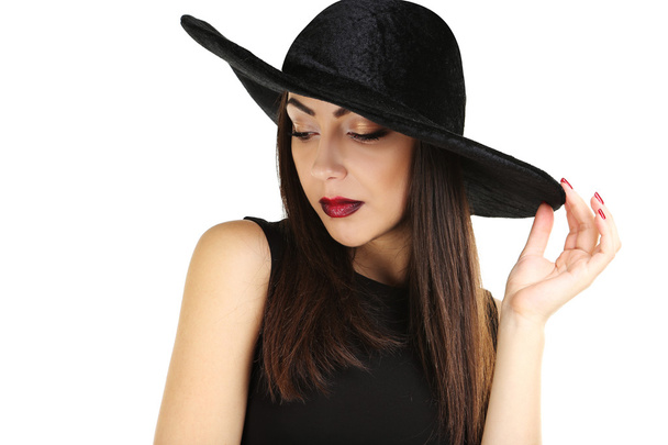brunette woman in black dress  and hat - Фото, зображення
