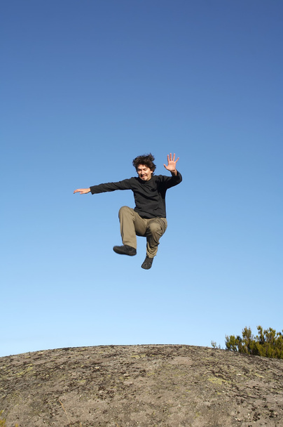 Man jumping on rocks - Fotó, kép