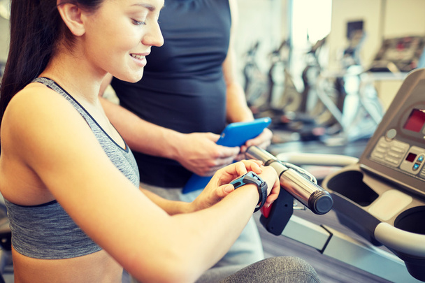 close up of woman setting heart-rate watch at gym - Φωτογραφία, εικόνα
