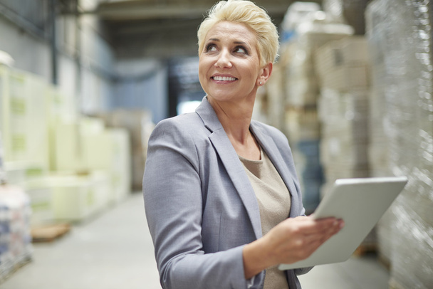 businesswoman working in warehouse - Photo, image