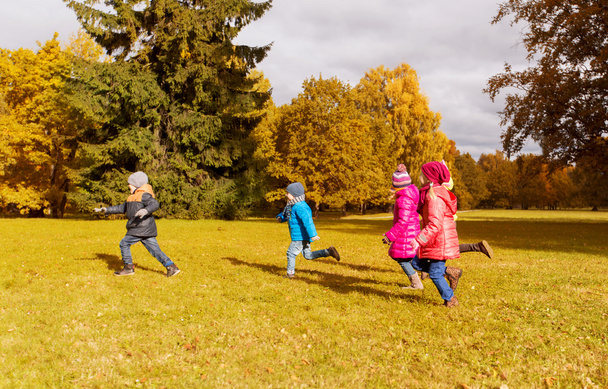 group of happy little kids running outdoors - Foto, imagen