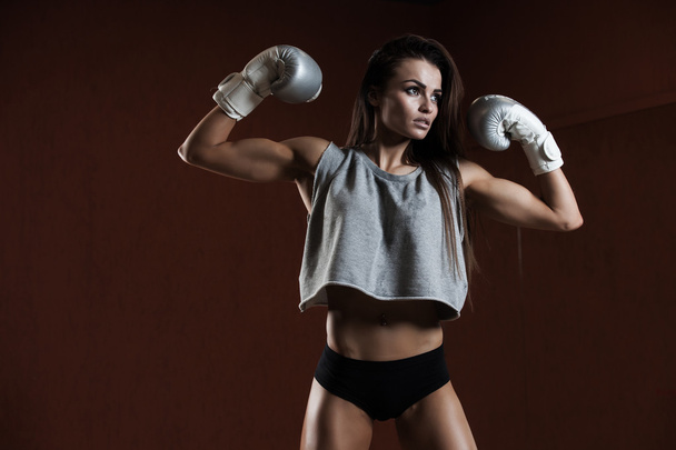 Young sexy girl with boxing gloves. - Valokuva, kuva