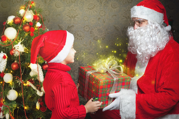 Happy boy and Santa Claus with big gift box - Zdjęcie, obraz