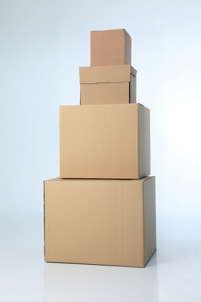 Stack of brown cardbox on the plain background - Фото, зображення