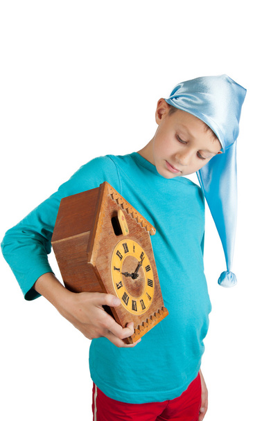 Симпатичний хлопчик тримає годинник ізольовано на білому
 - Фото, зображення
