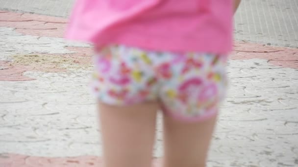 Children, Kids Are Playing at The Playground, Girl's Feet Closeup, Walking by Paved Road, Girl in Brown Skirt, Another Girl, Boy's Feet, Slow Motion - Materiał filmowy, wideo