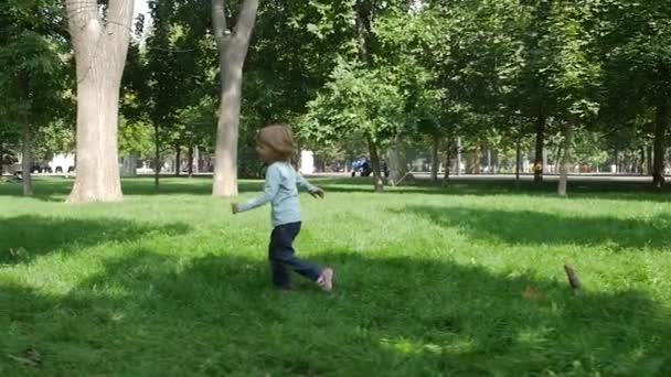daughter happily running towards her mom. Slow motion - Felvétel, videó