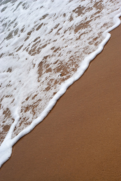 Ondas de praia lavando Ashore
 - Foto, Imagem