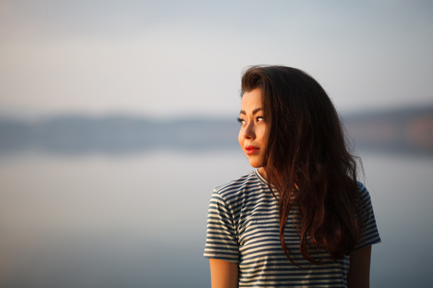 Girl on the background of lake - Photo, Image