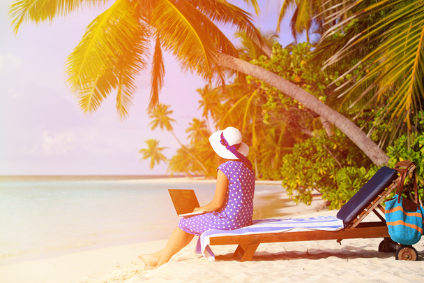young woman with laptop on tropical beach - Photo, Image