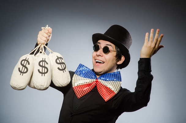 Смішний чоловік з грошима доларові мішки
 - Фото, зображення