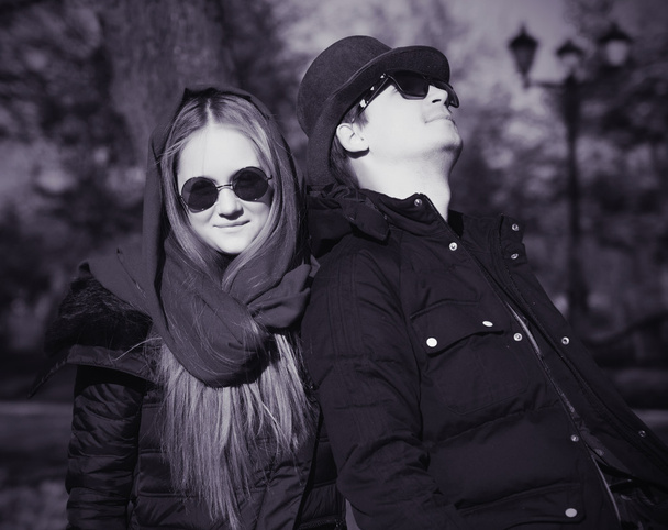 Casual young couple in a park. Black and white photo - Photo, Image