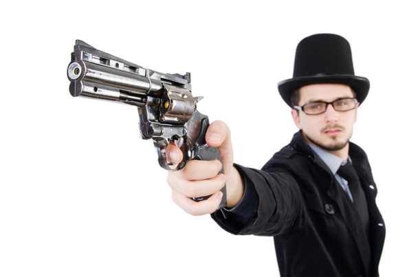 Νεαρός ντετέκτιβ με μαύρο παλτό κρατώντας όπλο που απομονώνονται σε λευκό - Φωτογραφία, εικόνα