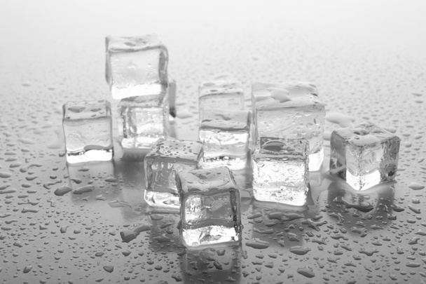Melting ice cubes on grey background, close up - Fotoğraf, Görsel