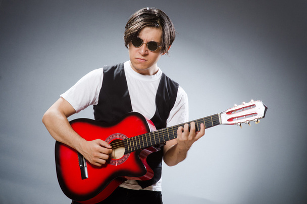 Funny guitar player in musical concept - Photo, Image