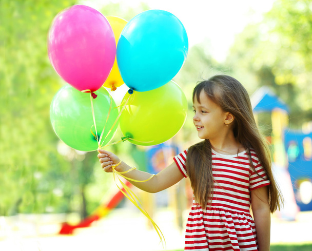Little girl with balloons  - Fotoğraf, Görsel